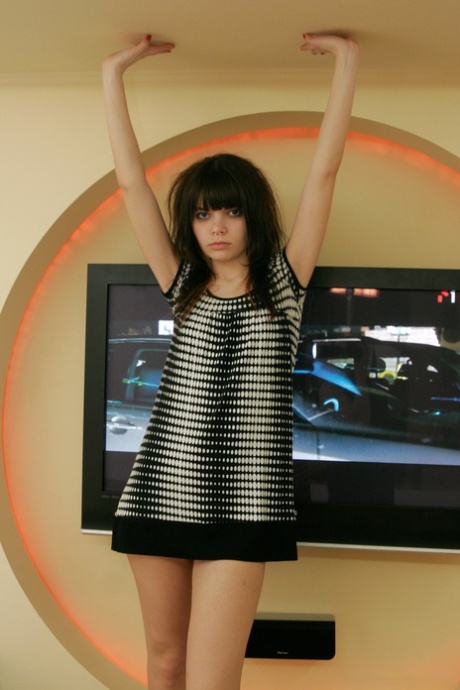 Young solo girl Kaira 18 gets totally naked in front of a television 23685307