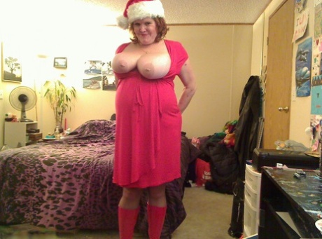 Mature redhead Misha MILF looses her big tits and cunt while in Xmas clothing 83270748