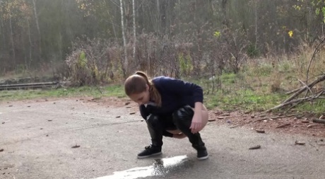 White girl Antonia Sainz pulls down her pants to pee on a road 28675529