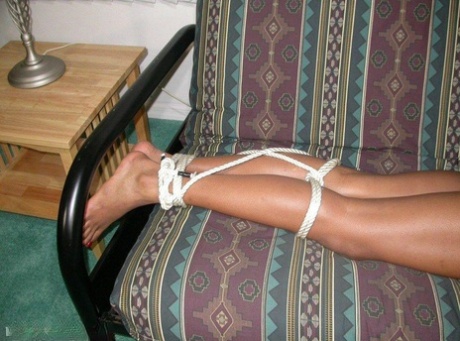 Long legged black girl finds herself hogtied and gagged on a futon 47421680