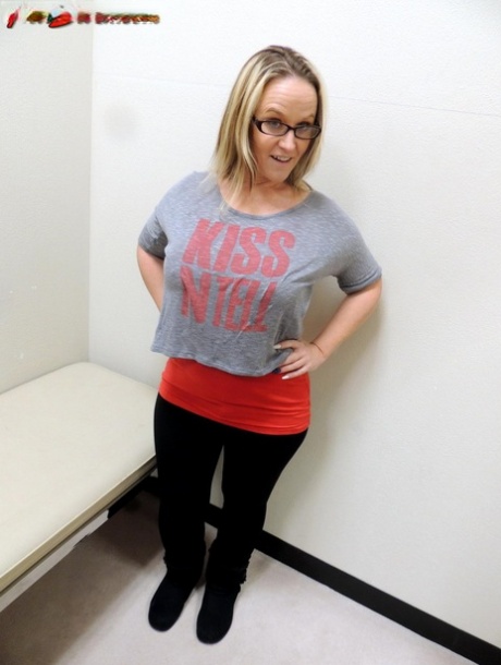Dee Siren pulls down her pants while looking in a dressing room mirror 80074156
