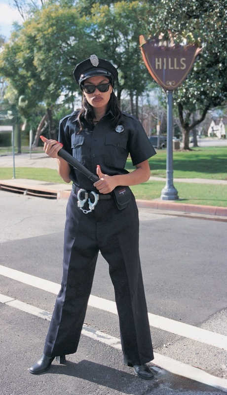 Ebony policewoman Cherry Lee masturbates at home before sex on a squad car