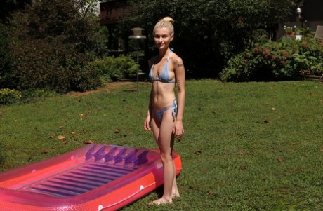 Skinny blonde teen Emma Rosie toys her pussy in a backyard wading pool 49453785