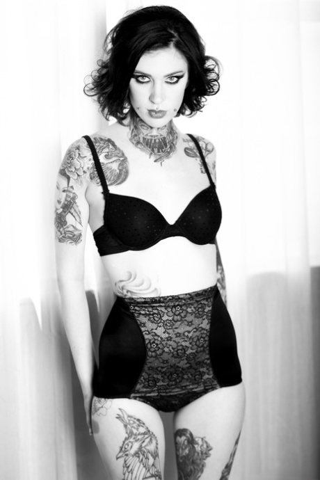 Tattooed chick Mabel fingers her pussy with her legs spread wide open 99460500